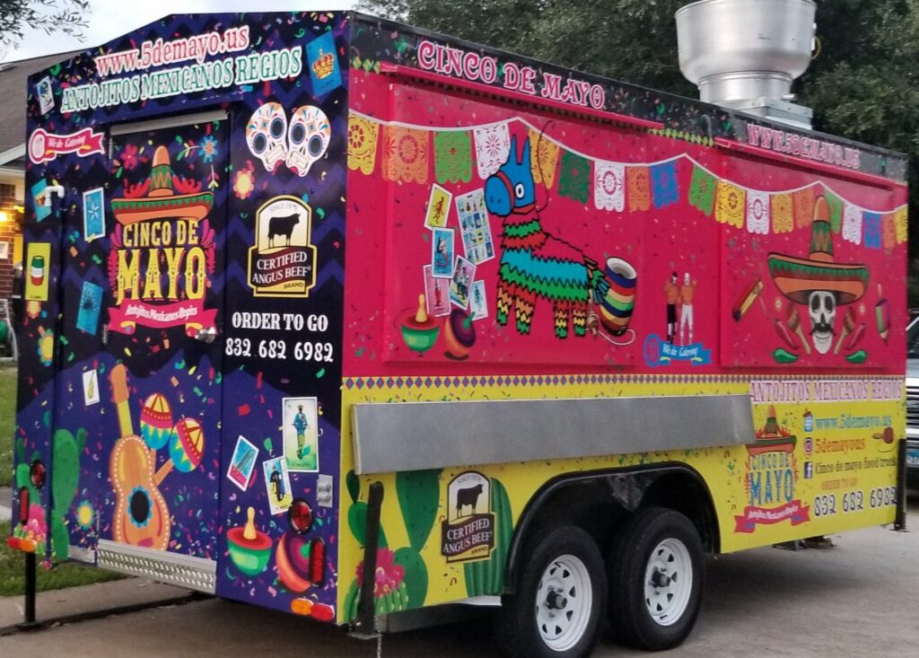 Cinco de Mayo's carnival style designed truck parked near the grass