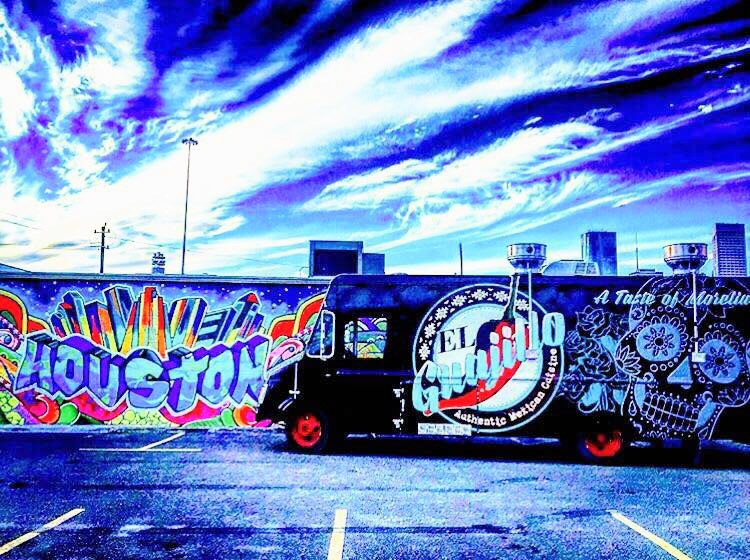 El Guajillo's truck parked near a wall art saying 'Houston'